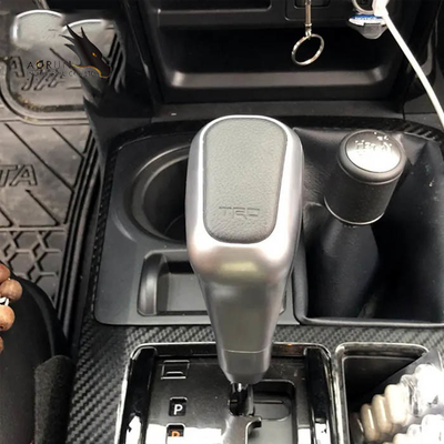 Pour Toyota les voitures ont personnalisé la voiture en cuir de rechange de bouton de changement de vitesse dénommant des accessoires